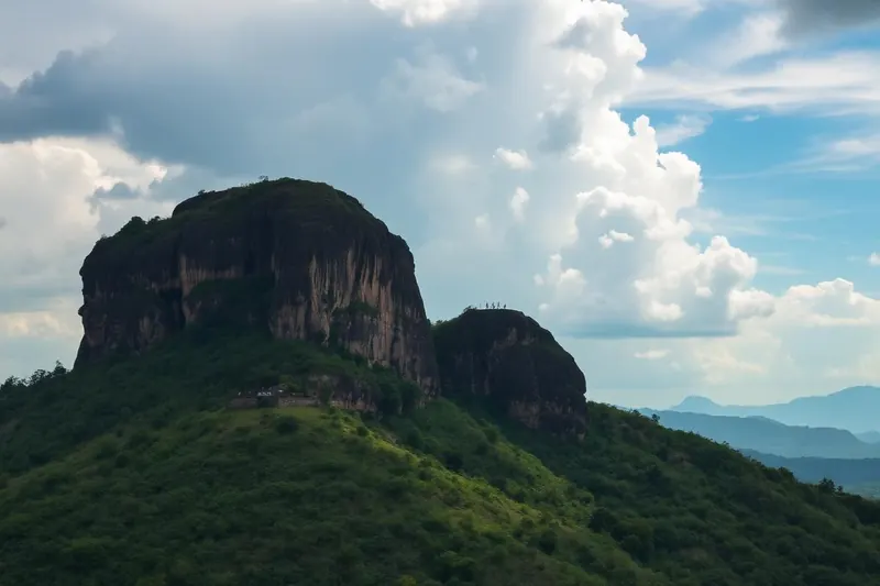 Sigiriya rock fortress rising above green plains